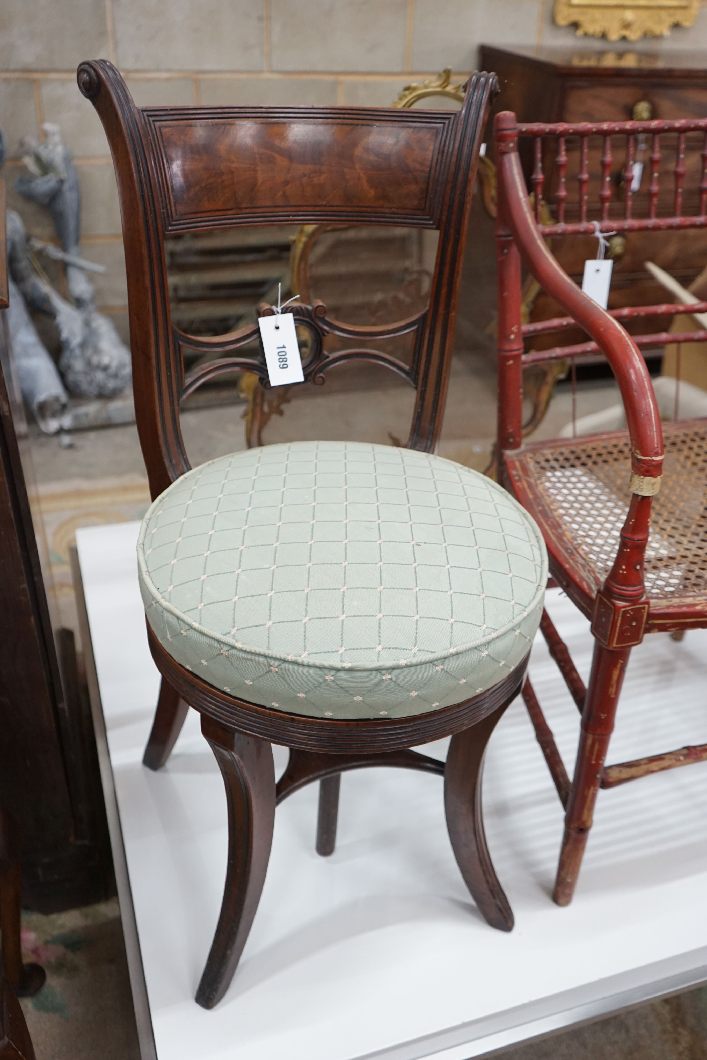 A Regency mahogany music chair with a revolving seat